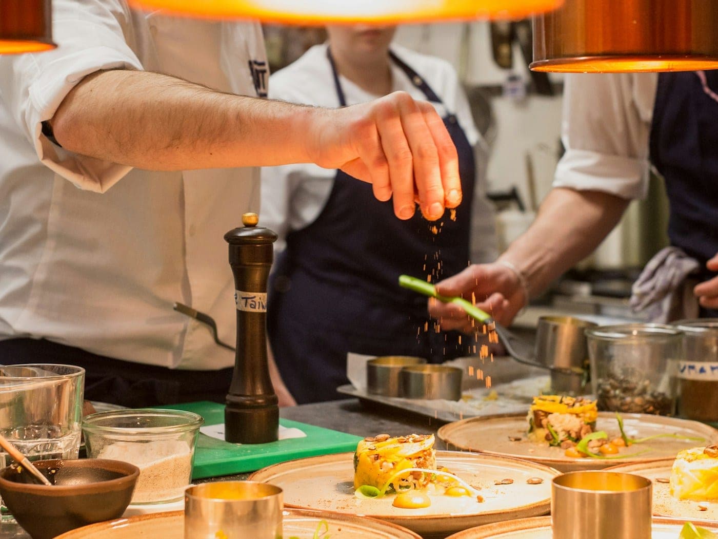 Chefs working the grill line during service